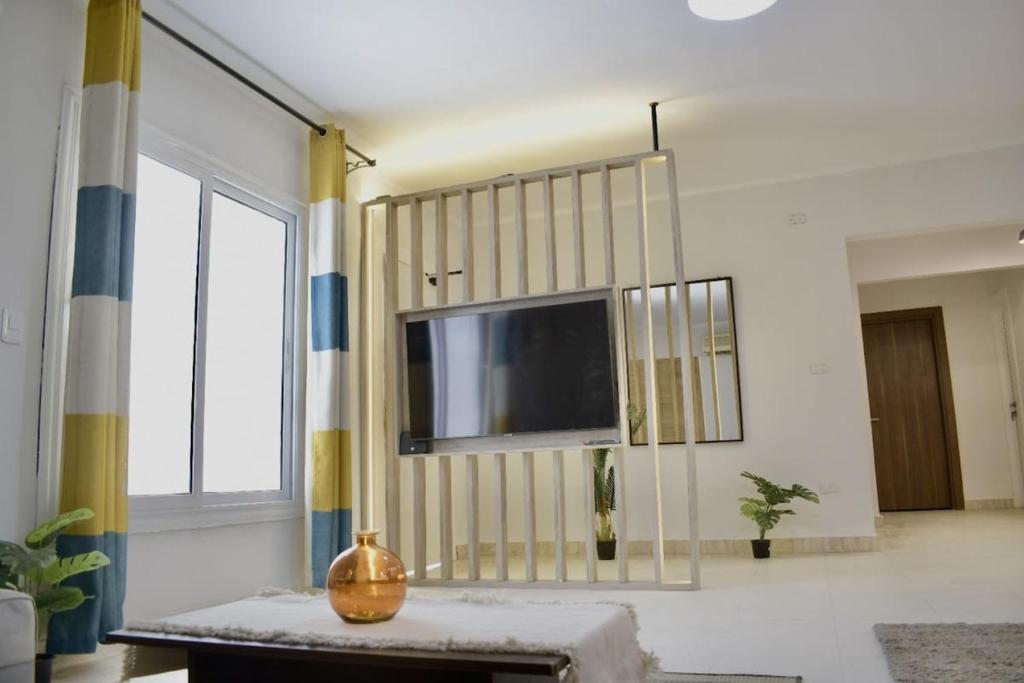 Al Motameyez Stylish 2BR Retreat with Private Garden