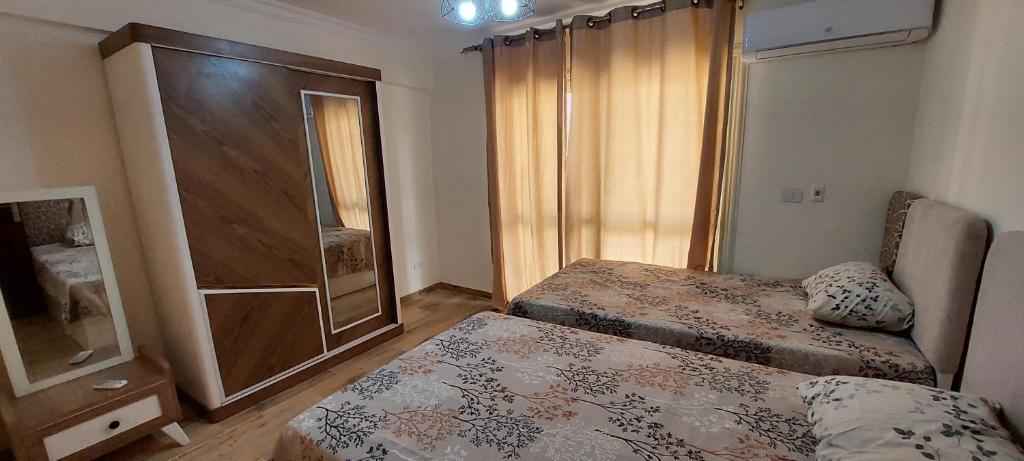 Fully finished 3-bedroom, 3-bathroom apartment with garden view in Jana Compound, Sheikh Zayed near Hyperone