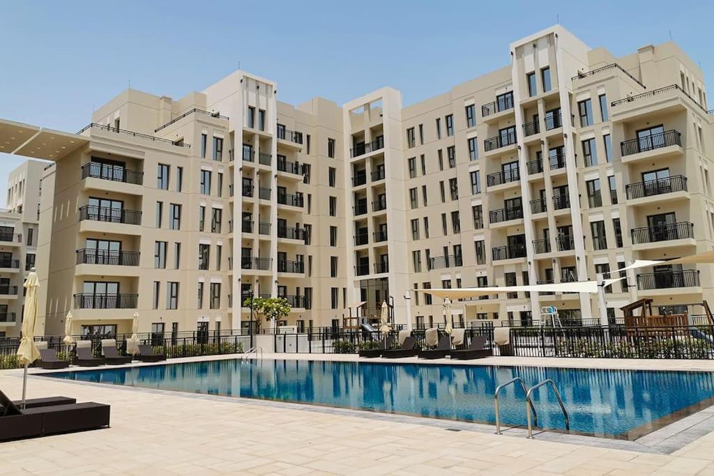 Lovely calm 3BR Apartment With Pool view in Town square Nshama