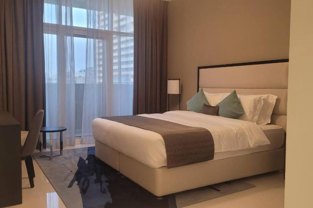 Minimalist Studio at Damac Tower 108 in JVC, Dubai by Vibel